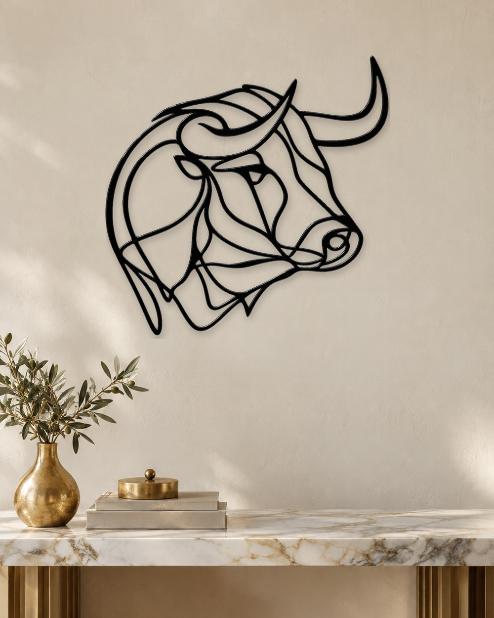 Bull's head drawn as one continuous line, laser-cut in gloss piano black acrylic and float-mounted on a pale wall.