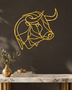 Mirror gold acrylic bull's head in a single continuous line, float-mounted above a console table.