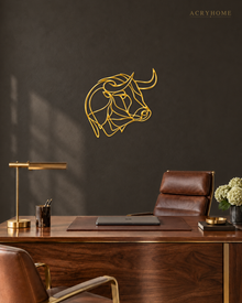 Mirror gold acrylic bull's head in a single continuous line, float-mounted above a console table.