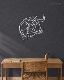 Mirror silver acrylic bull line-art wall piece standing off a neutral wall.