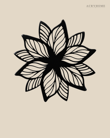 Layered Bloom flower wall art in gloss piano black acrylic, overlapping pointed petals float-mounted on a plain wall.