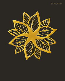 Layered Bloom flower wall art in mirror gold acrylic, layered petals catching light above a living room wall.