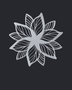 Layered Bloom flower wall art in Silver mirror chrome acrylic, geometric petals radiating from a central point on a pale wall.
