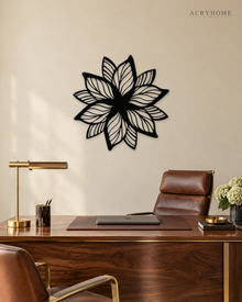 Layered Bloom flower wall art in gloss piano black acrylic, overlapping pointed petals float-mounted on a plain wall.