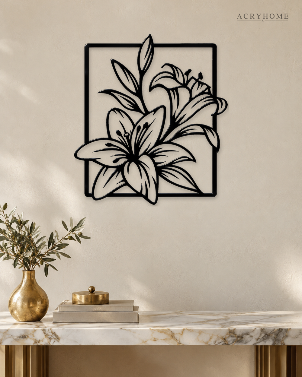 Lily line art wall piece in gloss piano black acrylic, stems and long leaves crossing a thin rectangular frame, float-mounted on a pale wall.