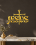 JESUS wall art in mirror gold acrylic, heavy block letters with a cross and nails set into the lettering and a banner beneath reading The Way, The Truth, The Life, float-mounted on a pale wall