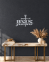 JESUS wall art in Silver mirror chrome acrylic, heavy block letters with a cross and nails set into the lettering and a banner beneath reading The Way, The Truth, The Life, float-mounted on a pale wall