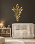 Floral filigree cross wall art in mirror gold acrylic, vines and blossoms catching warm light