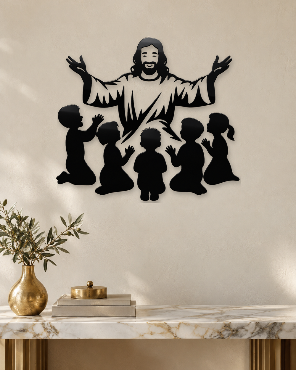 Silhouette of Jesus with arms outstretched above kneeling children, laser-cut in gloss piano black acrylic and float-mounted on a pale wall.