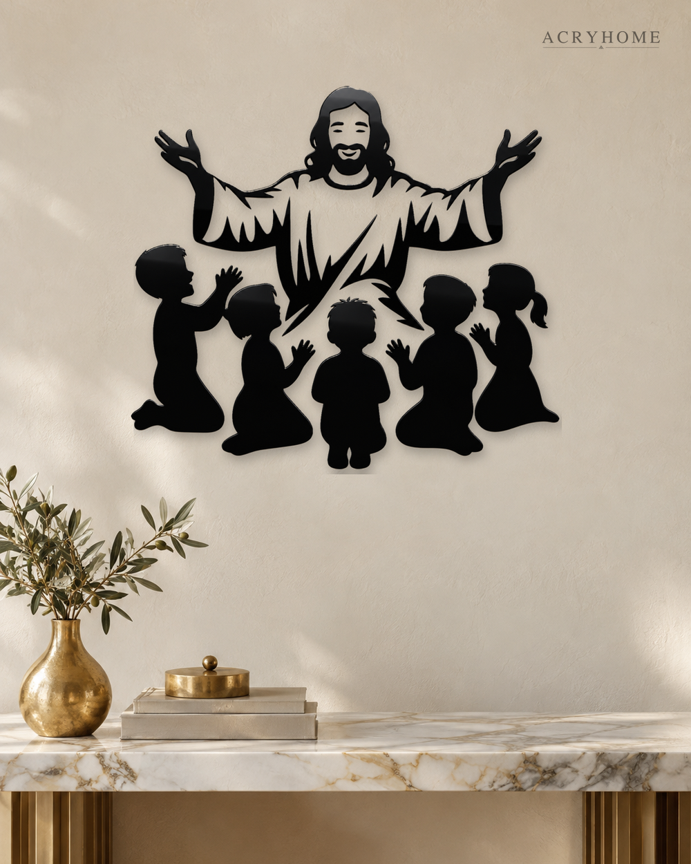 Silhouette of Jesus with arms outstretched above kneeling children, laser-cut in gloss piano black acrylic and float-mounted on a pale wall.
