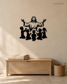 Silhouette of Jesus with arms outstretched above kneeling children, laser-cut in gloss piano black acrylic and float-mounted on a pale wall.