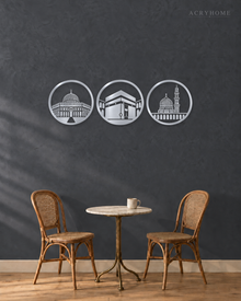 Three Holy Mosques Roundels — Acrylic Islamic Wall Art in mirror silver acrylic, float-mounted on a deep graphite wall