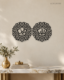 Pair of Arabic Calligraphy Roundels Wall Art in gloss piano black acrylic, float-mounted on a pale ivory wall.