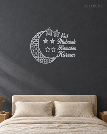Crescent Moon and Stars Ramadan Wall Art in mirror silver acrylic, float-mounted on a deep graphite wall.