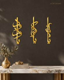 Three-Piece Vertical Arabic Calligraphy Set in mirror gold acrylic, float-mounted on a deep charcoal wall.