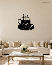 Black and white coffee cup wall clock hung on a living room wall.