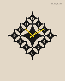 Flat view of the floral diamond clock, white petal pattern cut into black with beaded points.
