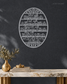 Start with Bismillah Oval Panel — Acrylic Islamic Wall Art in mirror silver acrylic, float-mounted on a deep graphite wall