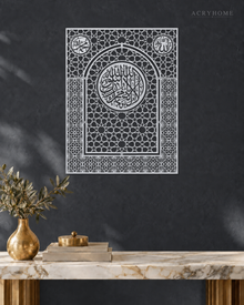 Shahada Mihrab Arch — Acrylic Islamic Wall Art in mirror silver acrylic, float-mounted on a deep graphite wall