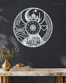 Alhamdulillah Clock-Face Roundel in mirror silver acrylic, float-mounted on a deep graphite wall