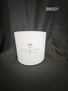 Deep round presentation box in white leatherette with gold Bloomistry mark