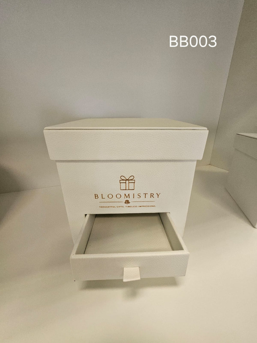 Square ivory gift box with lid and concealed pull-out drawer