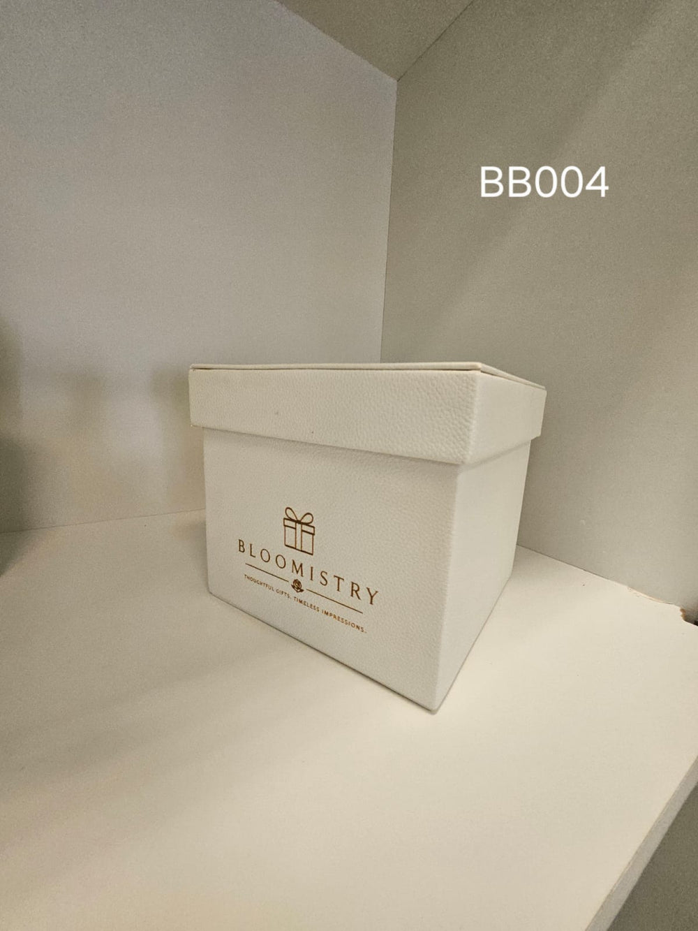 Rectangular ivory leatherette box with lift-off lid