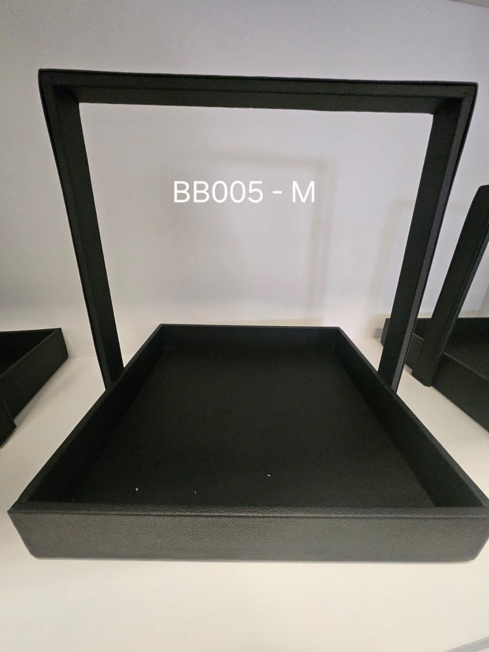 Black floating frame display box with clear suspended membrane