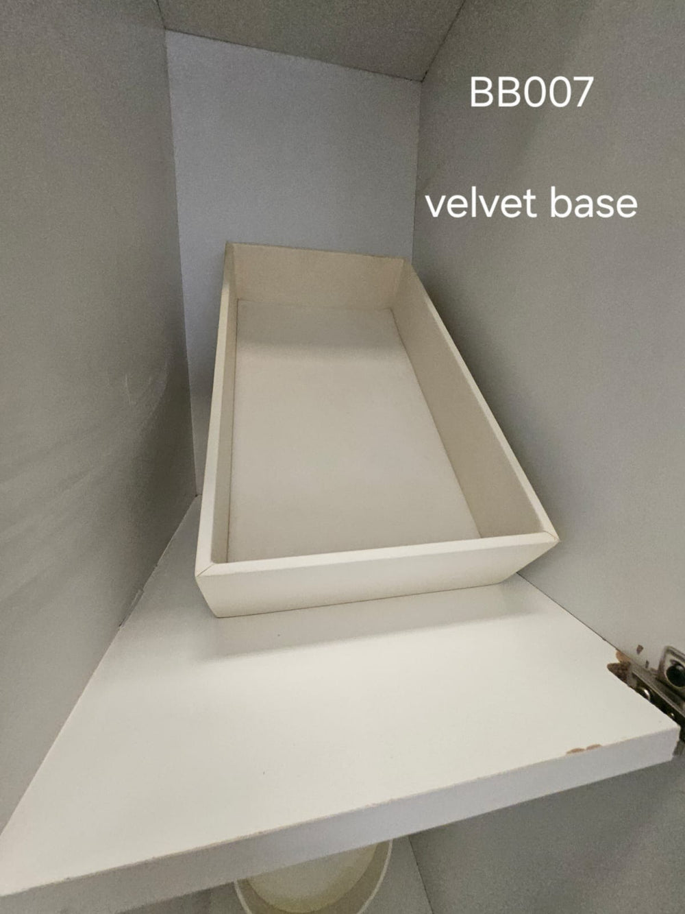 Shallow ivory rectangular tray with velvet base