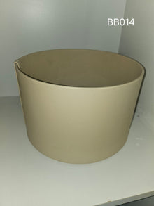 Tapered round box in warm sand