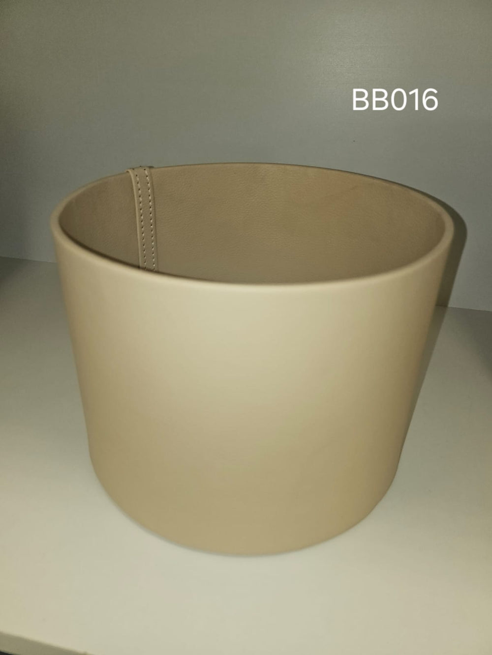 Mid-size tapered round box in cream with a stitched seam
