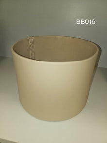 Mid-size tapered round box in cream with a stitched seam