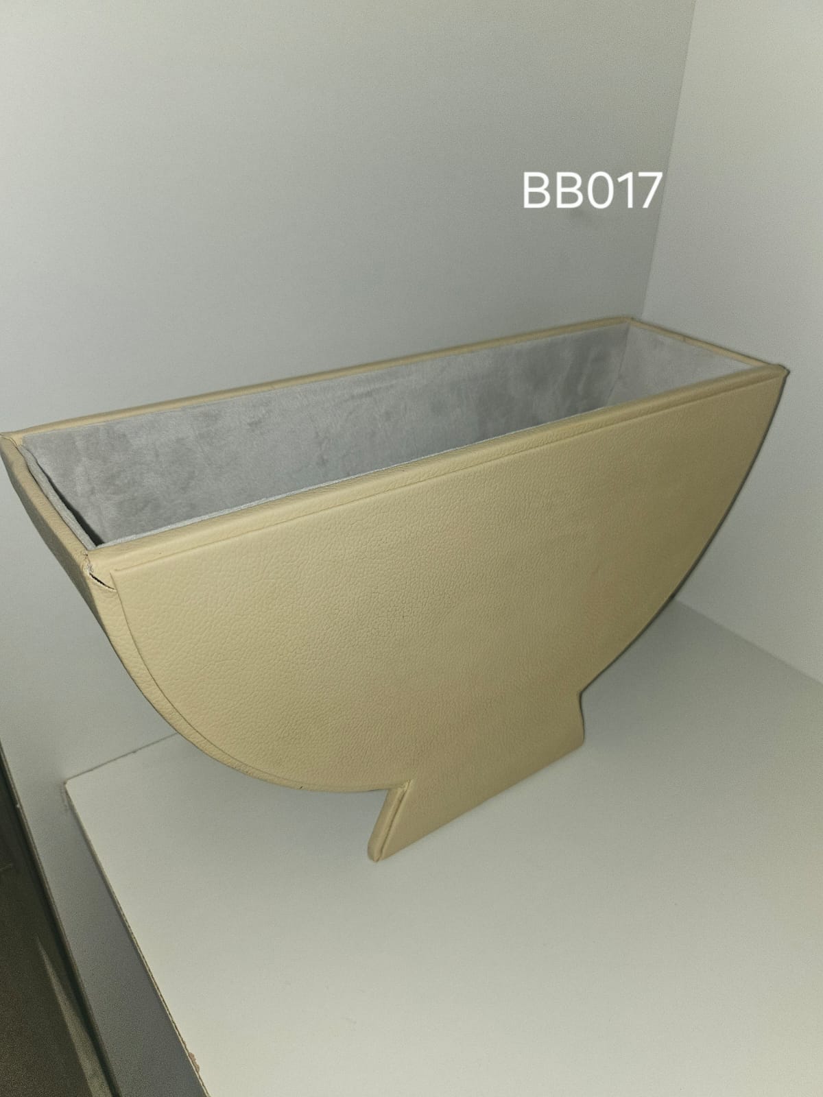 Elongated cream box drawn to a point at one end