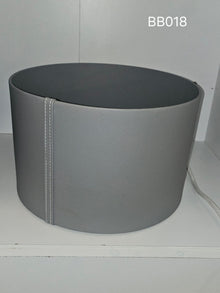 Deep oval box in grey with a stitched seam