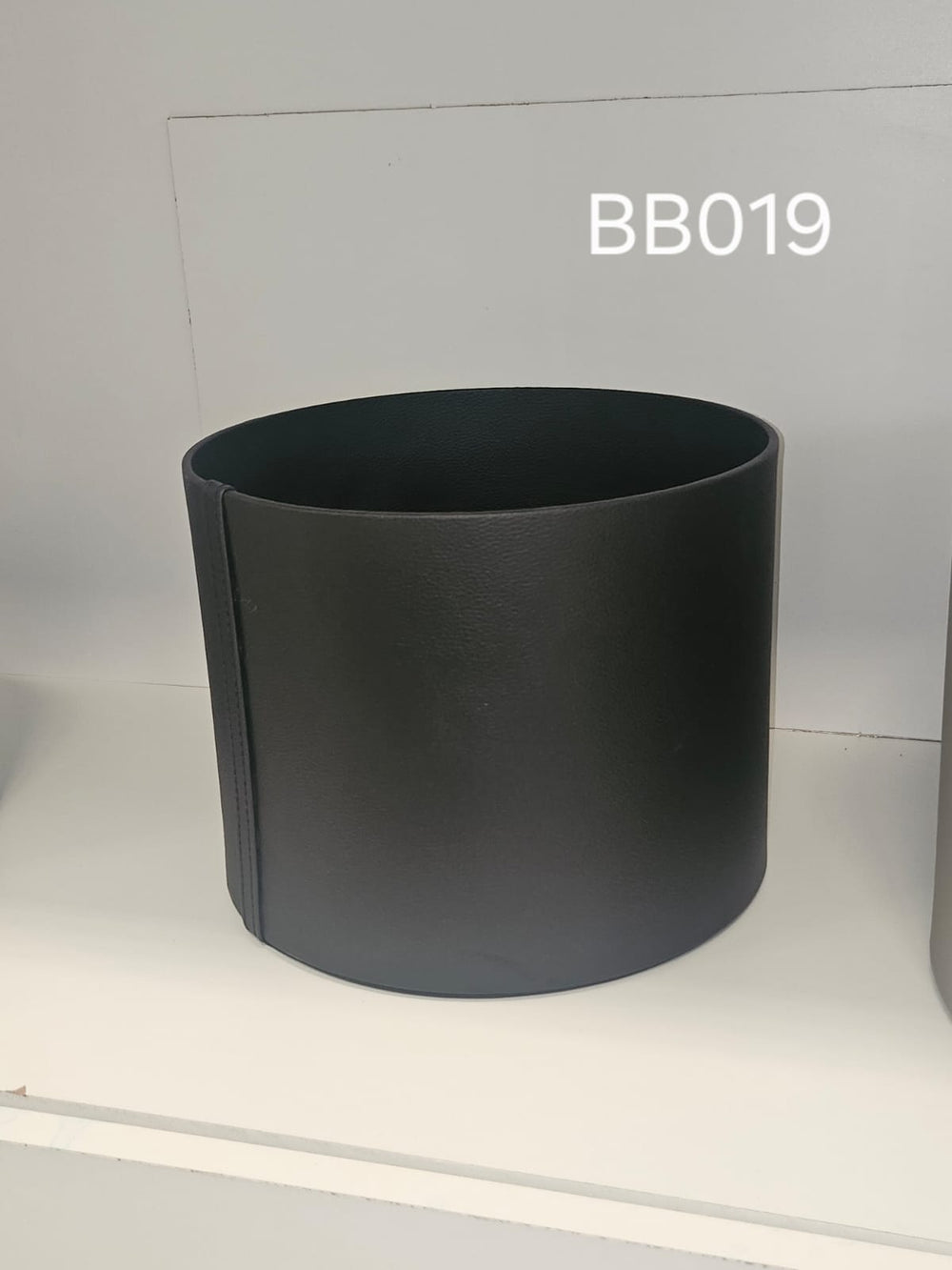 Tall straight-walled round box in matte black