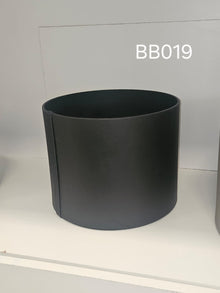 Tall straight-walled round box in matte black