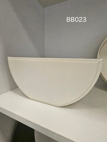 Half-moon box in ivory, flat along one edge